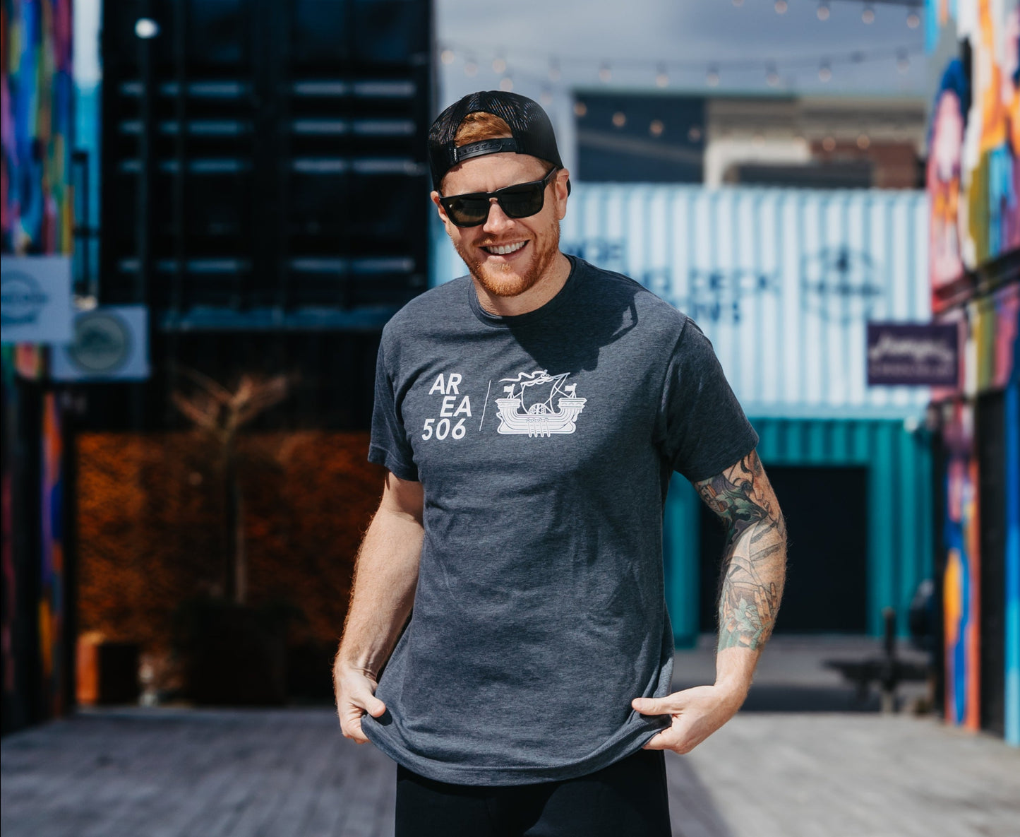Grey t-shirt with the AREA 506 galley ship logo printed in white on the full chest.