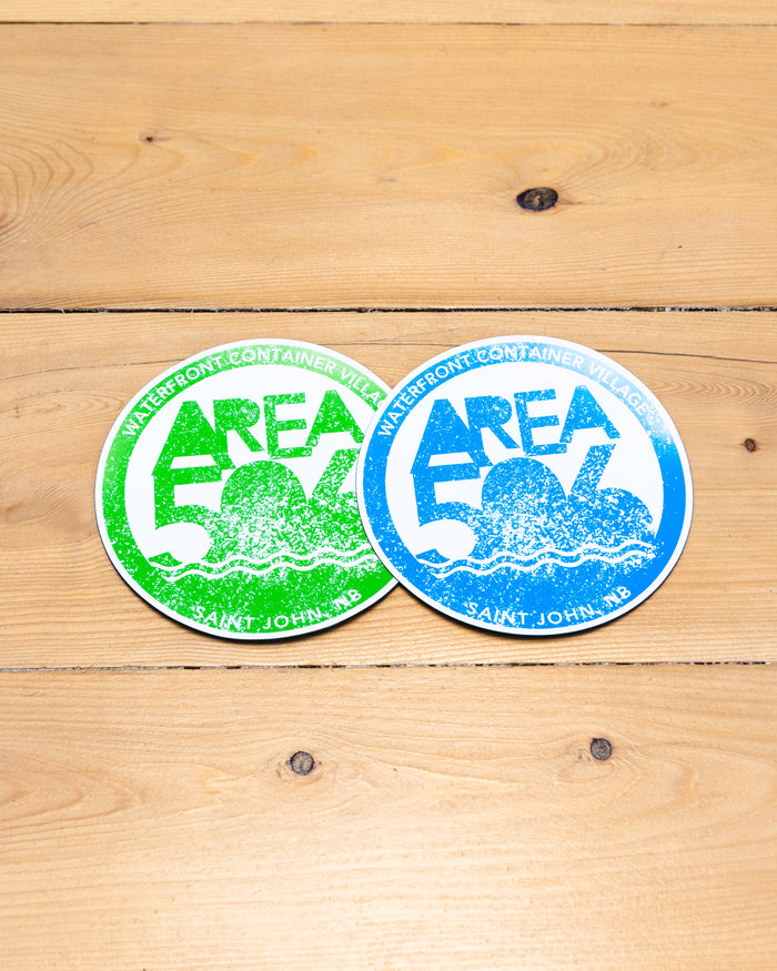 Blue or green circle magnet with AREA 506 logo, and Waterfront Container Village, Saint John, NB text. 