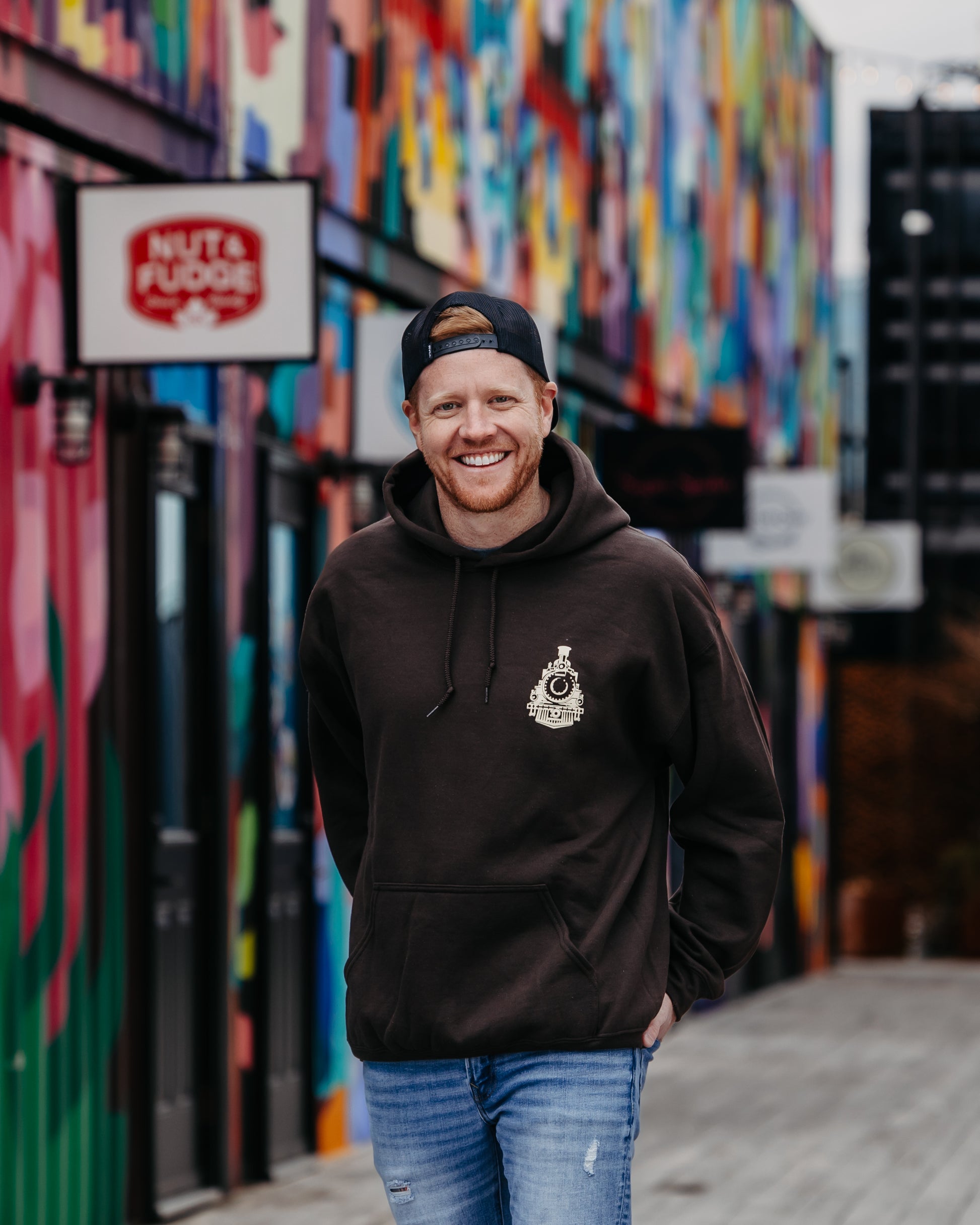 Brown pullover hoodie featuring the Boxcar Country Music Festival logo. Upper left chest and a full-sized logo on the back.