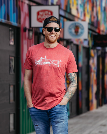 Navy, Sky Blue, Orange, Red, Charcoal, Brown, Purple or Green t-shirts featuring the Saint John New Brunswick Cityscape.  AREA 506 Waterfront Container Village Saint John NB text printed in white.