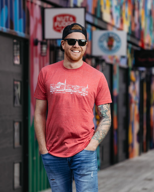 Navy, Sky Blue, Orange, Red, Charcoal, Brown, Purple or Green t-shirts featuring the Saint John New Brunswick Cityscape.  AREA 506 Waterfront Container Village Saint John NB text printed in white.