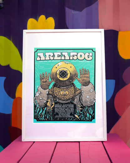 Framed poster of a diver in a vintage diving suit with 'AREA 506' text against a colorful abstract background.