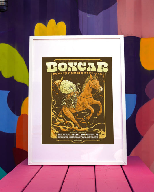 A collectable 2024 Boxcar Country Music Festival poster featuring illustrations of a horse and a guitar, with text detailing the festival lineup.